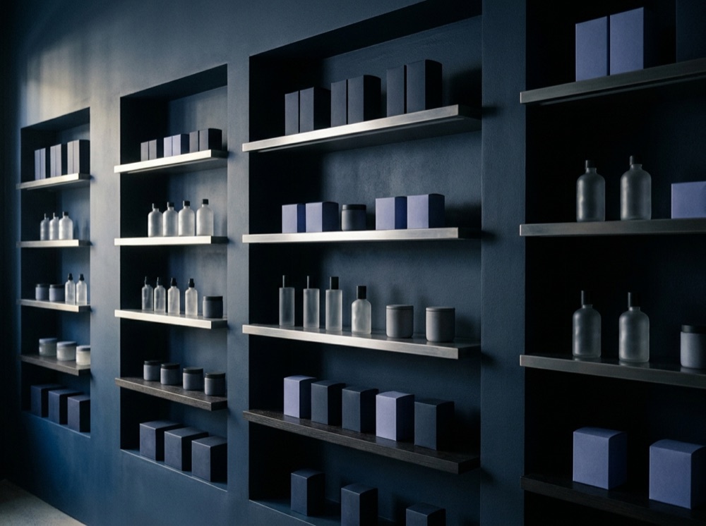 Curated K-beauty products on a minimal showroom wall
