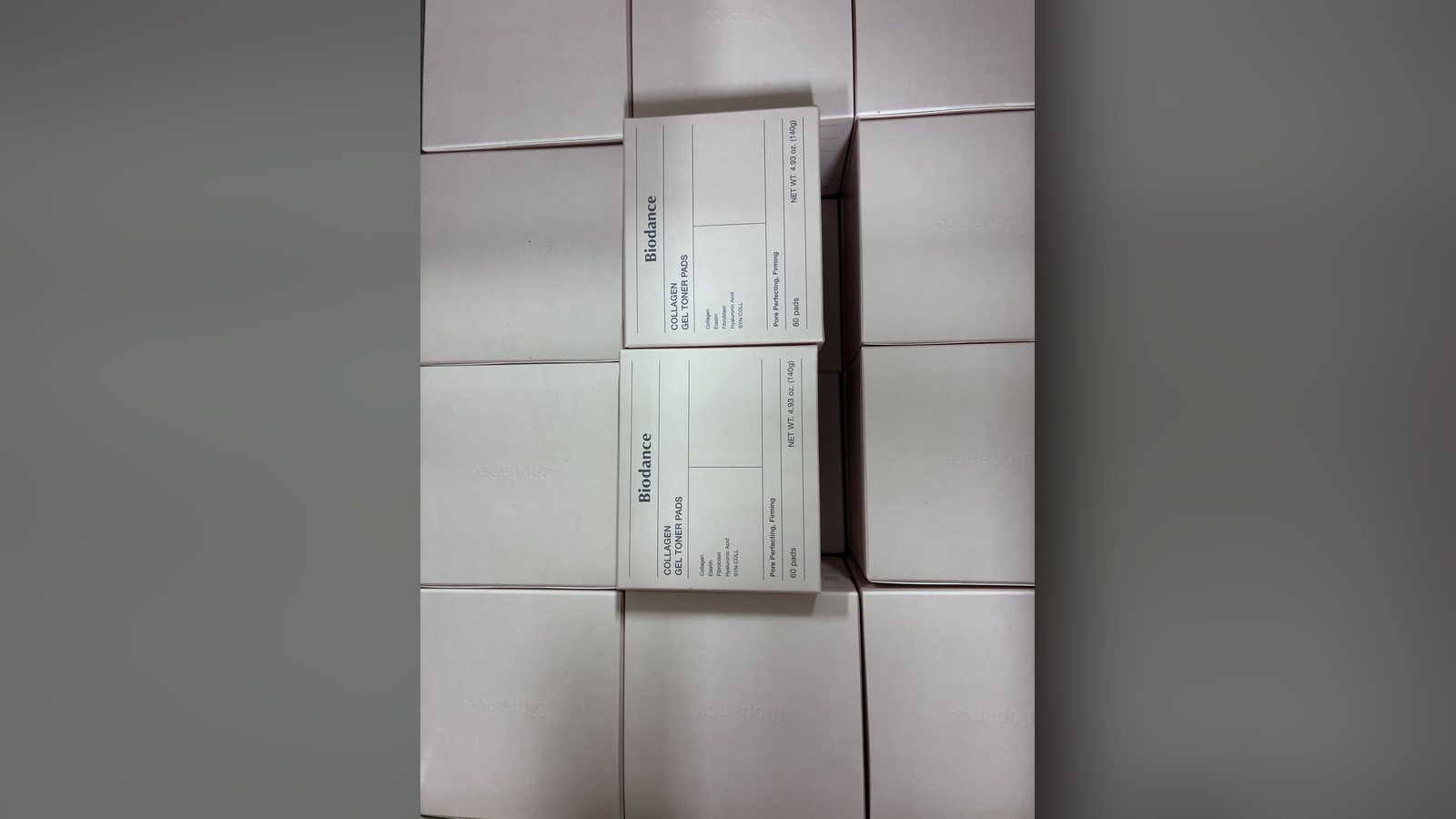 Stacked master cartons of Biodance Collagen Gel Toner Pads
